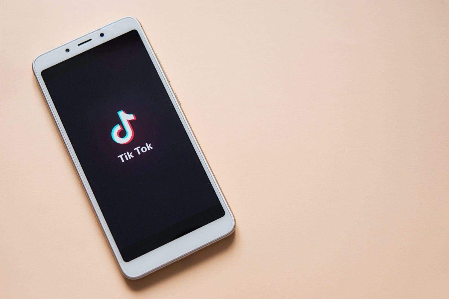 A mobile phone with a TikTok app opened in it. It indicates the news about Montana's TikTok ban.