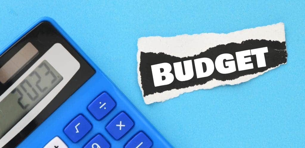 the word budget on a small piece of paper