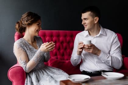 Bride and groom enjoying a coffee together.