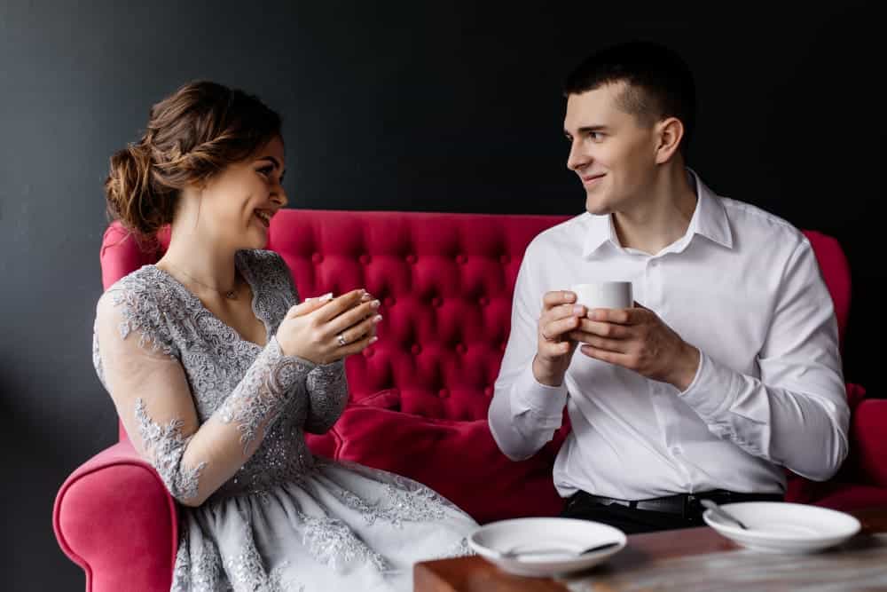 Home 23 Bride and groom enjoying a coffee together.