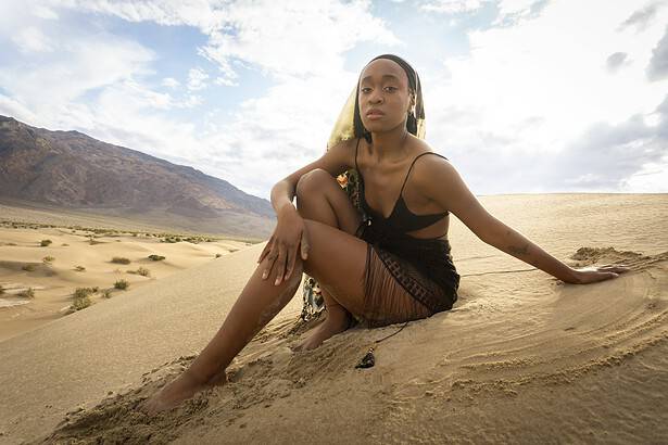 A model sitting on the beach